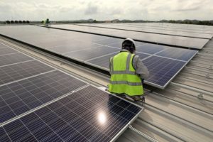 man working on solar