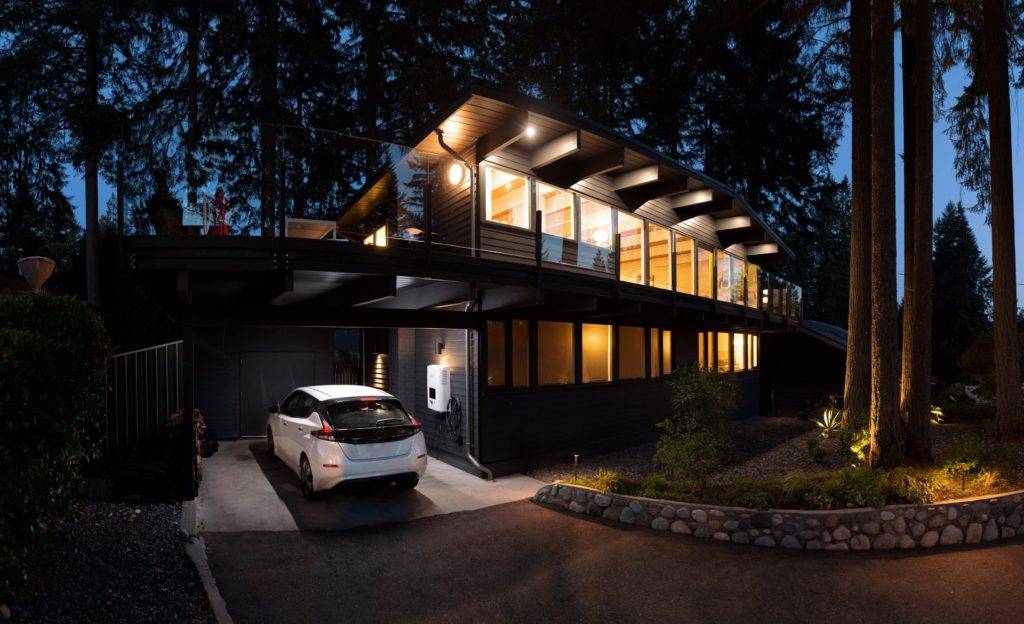 Electric Car being charged at a modern home